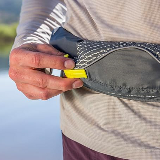 Manually inflatable waist pack
