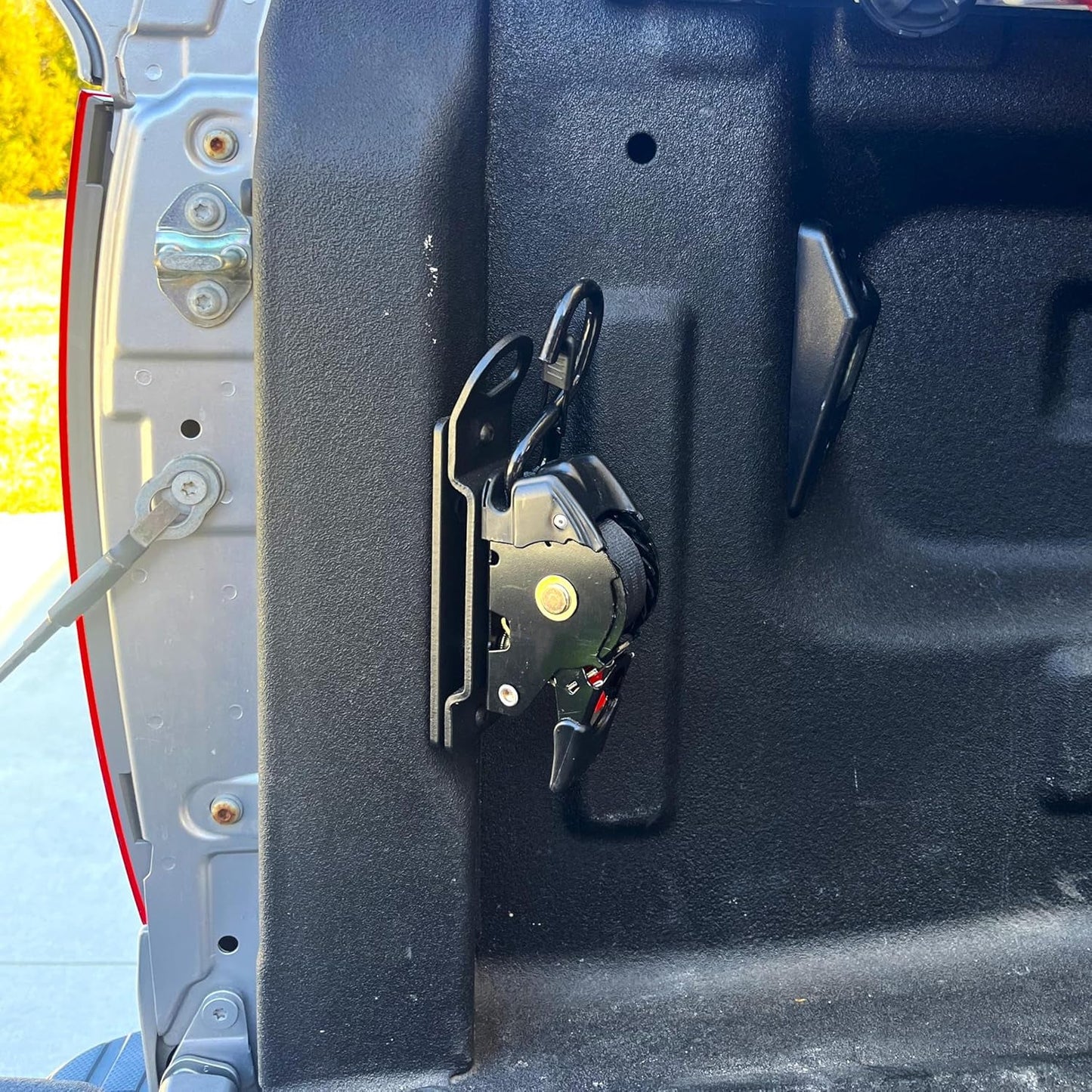 Integrated Retractable Tie-Down Strap with Universal Swivel Joint